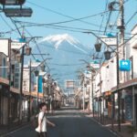 A peaceful street in Fujinomiya, Japan, showcasing Mount Fuji in the background.